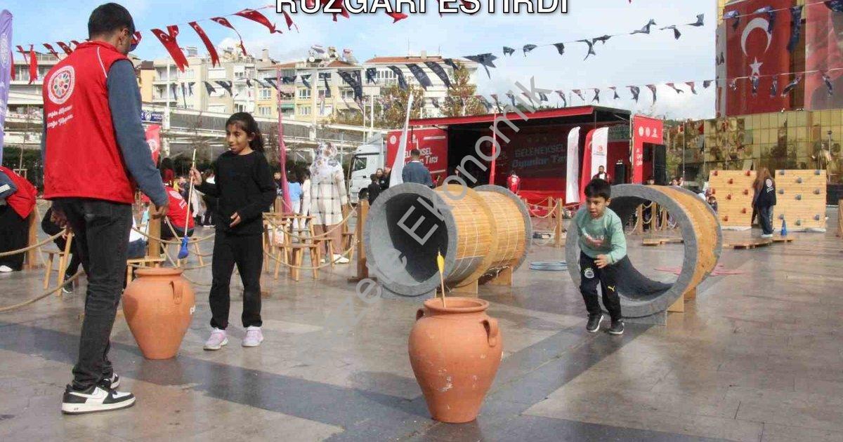 "Geleneksel Oyun Tırı Aydın'da Eğlence Rüzgarı Estirdi" başlıklı haber için fotorealistik, profesyon